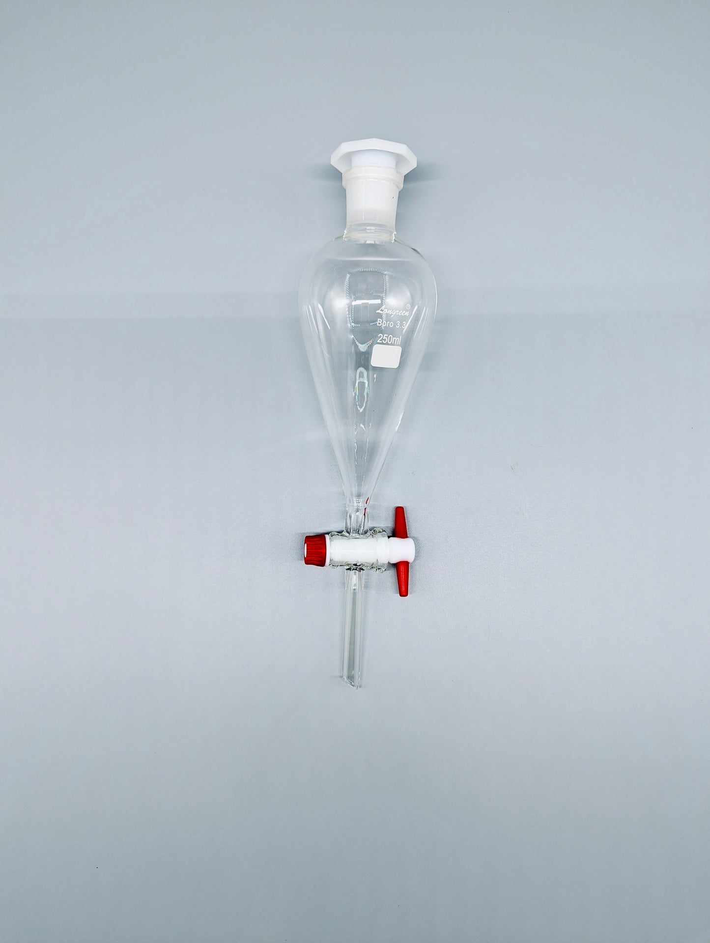 Separatory funnel with PTFE stopcock and plastic stopper