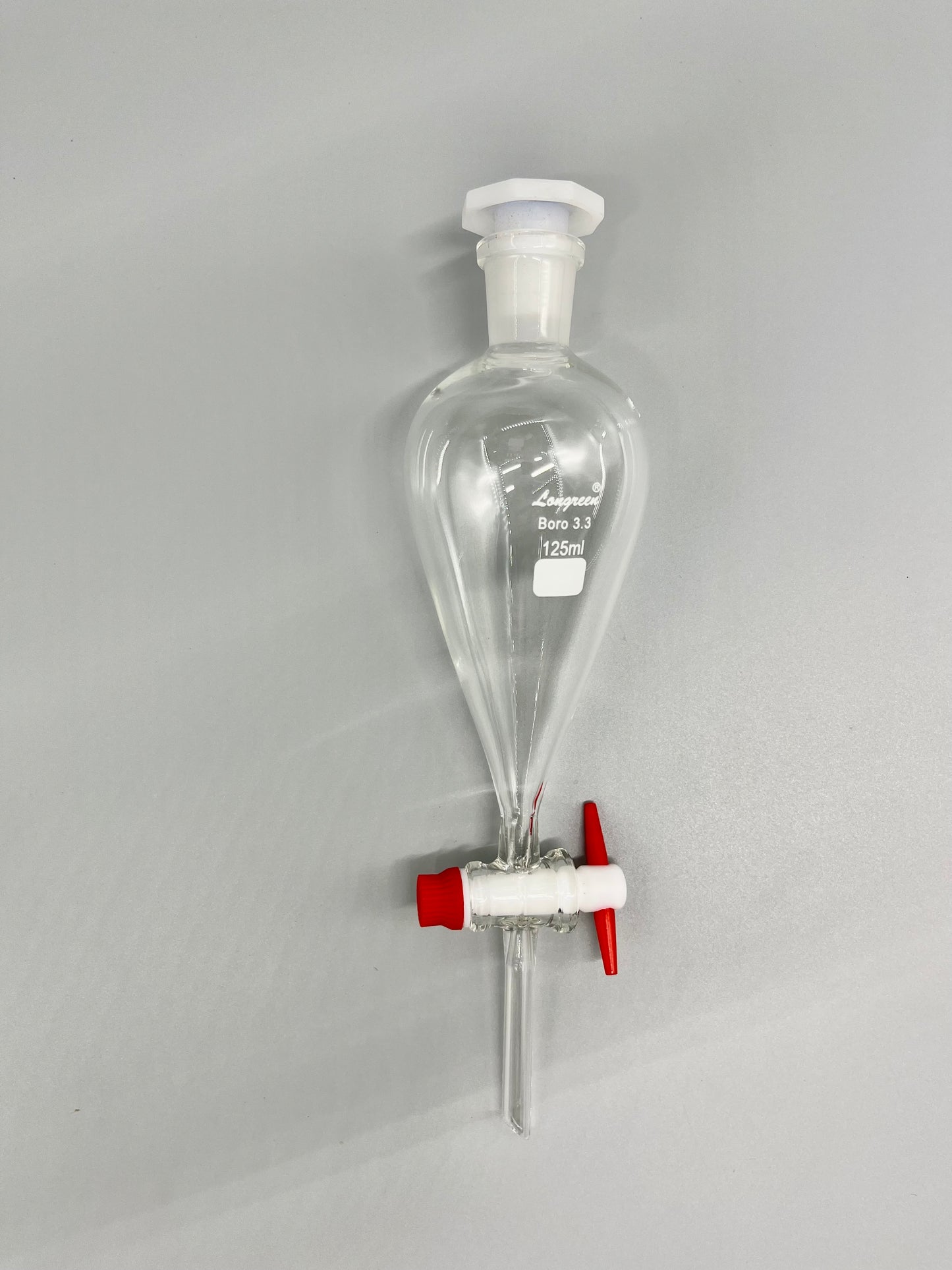 Separatory funnel with PTFE stopcock and plastic stopper
