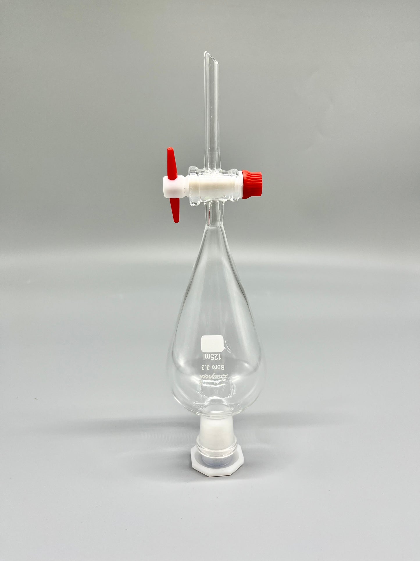 Separatory funnel with PTFE stopcock and plastic stopper